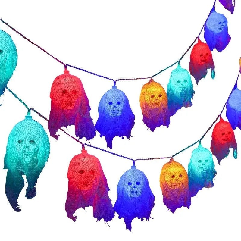 Halloween decoration LED fairy lights in coloured or warm white on a dark wall