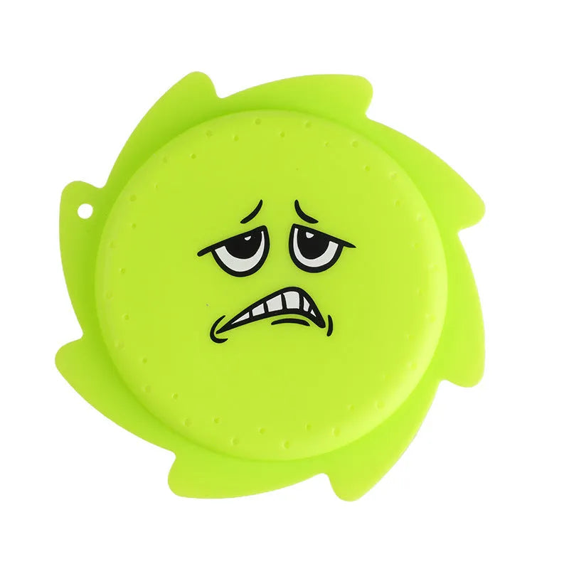 Silicone water toy in blue expression style on a wet surface for bath play