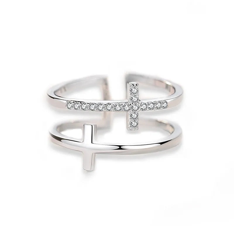 Adjustable copper ring with clear zircon stone in geometric setting, shown in gold electroplated finish