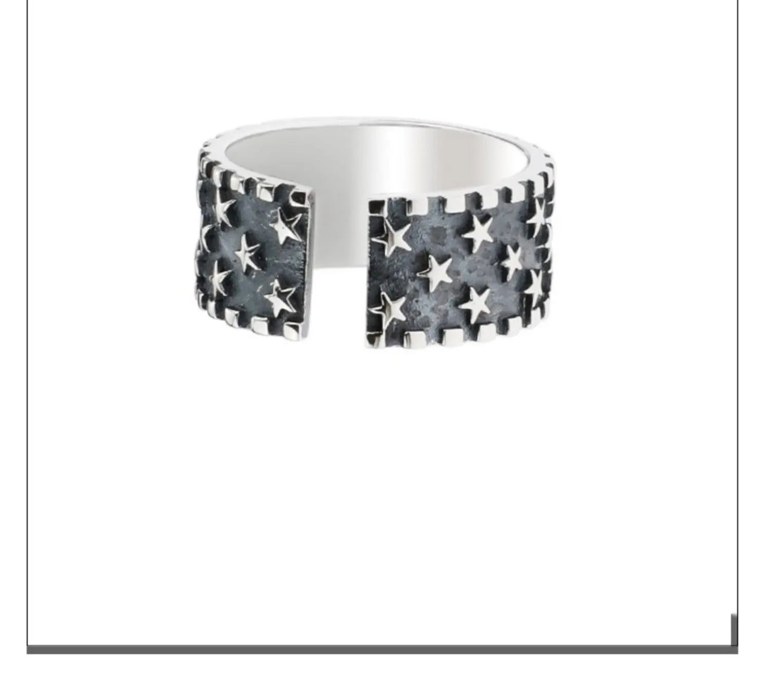 Sterling silver ring with a five-pointed star pattern and an adjustable open band.
