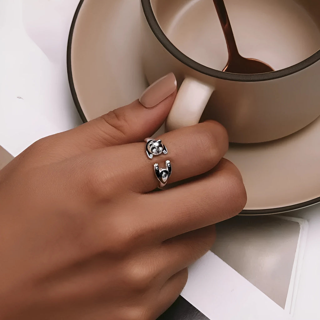 Adjustable sterling silver panda ring with white gold plating and open design