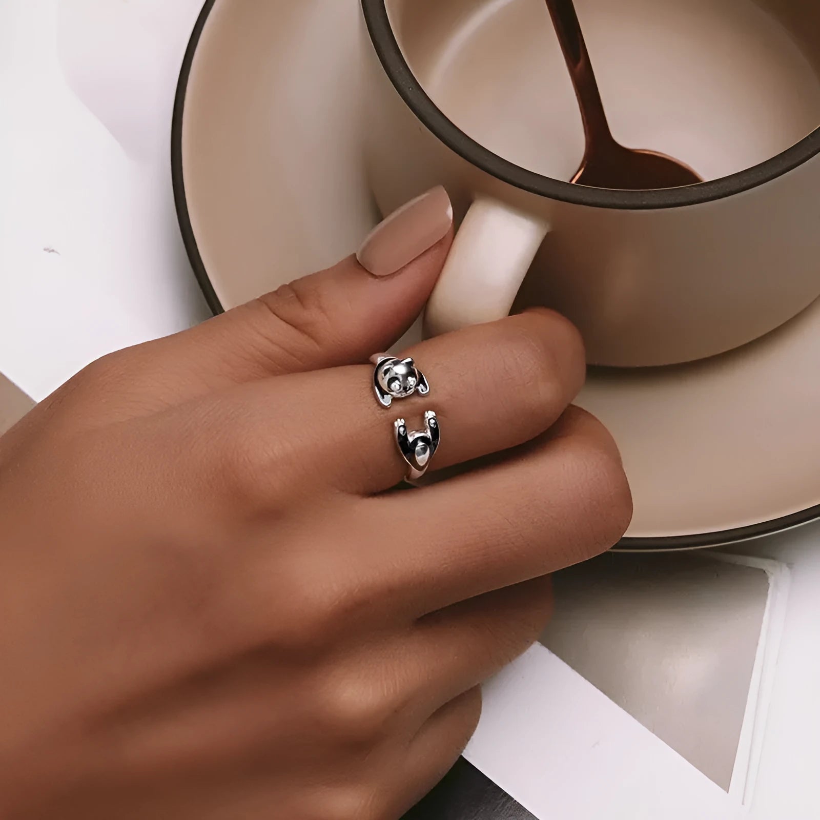 Adjustable sterling silver panda ring with white gold plating and open design