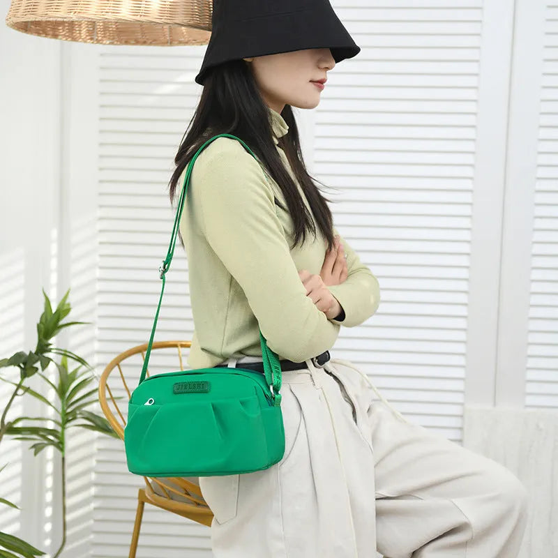 Pleated Oxford cloth shoulder messenger bag in horizontal square shape with crossbody strap