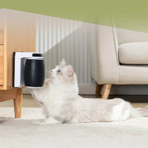 White automatic cat self grooming brush mounted in corner with silicone bristles
