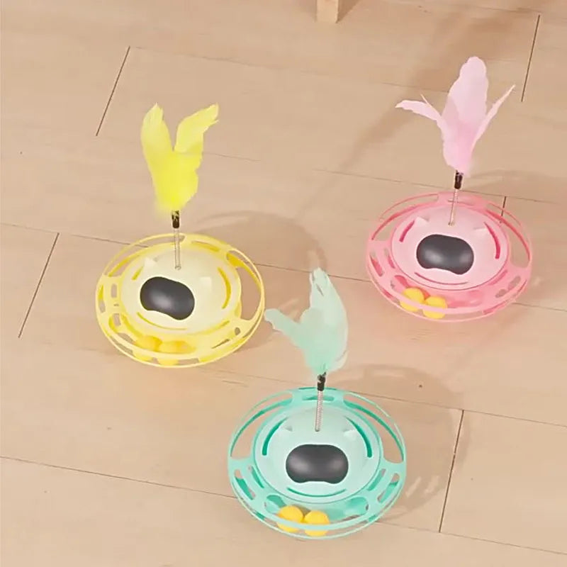 Pink cat tumbler turntable toy with rotating platform and dangling cat stick for interactive feline play