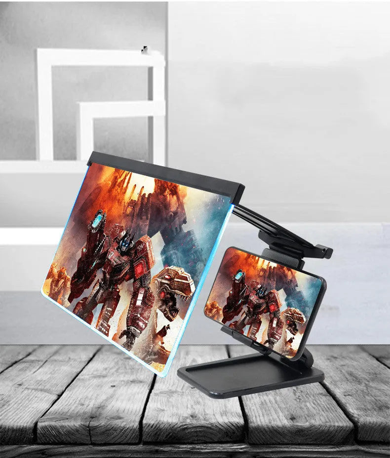 Black foldable mobile phone screen amplifier with detachable holder on a desk