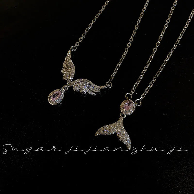 Women's sterling silver necklace showing Angel Wings and Fishtail pendant options on an adjustable O-ring chain.