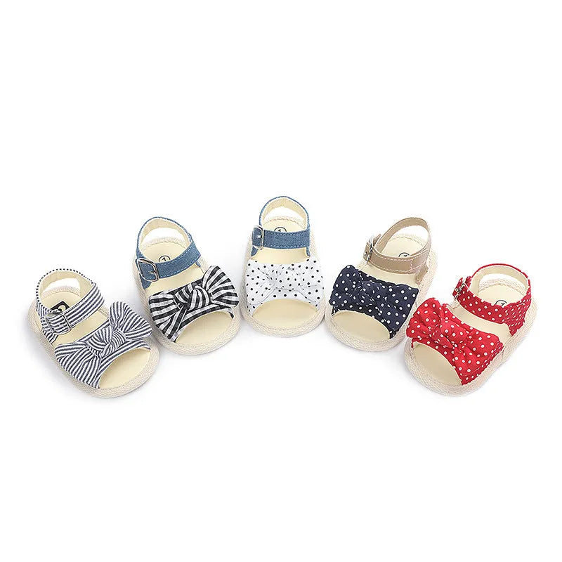 White and black low-tube Velcro baby shoes showing sizes 11cm, 12cm, and 13cm