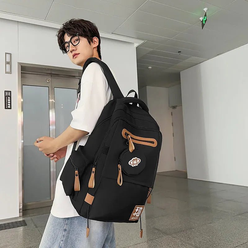 Large black waterproof nylon travel backpack with contrast stitching, shown with a 20-35L capacity.