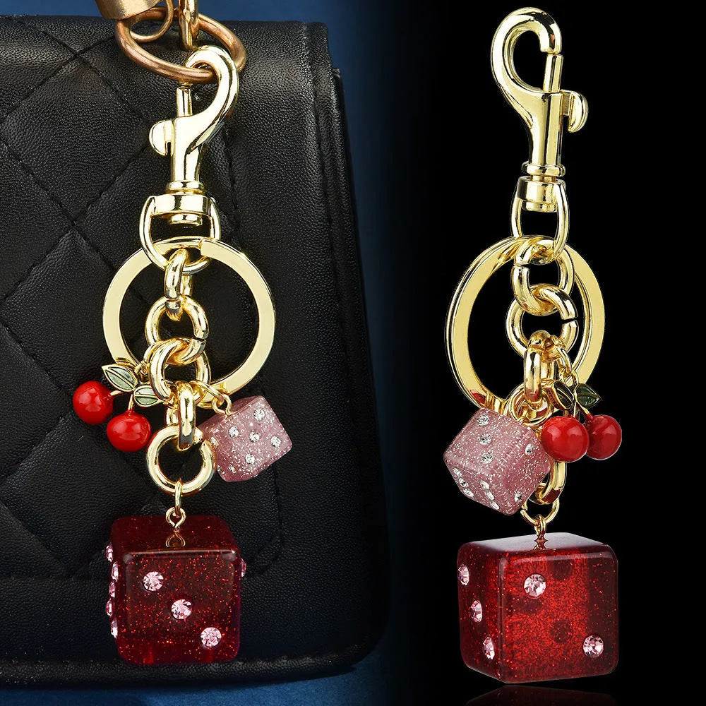 Metal hanging dice keychain pendant in cherry two-tone colour, square shape, vintage style