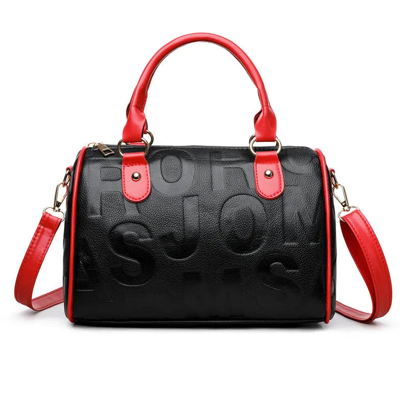 Brown cylindrical PU crossbody bag with a leather-like texture and three shoulder straps.