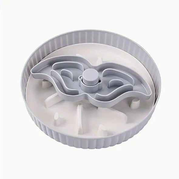 Slow feeder dog bowl with rotating game board and textured silicone licking mat insert.