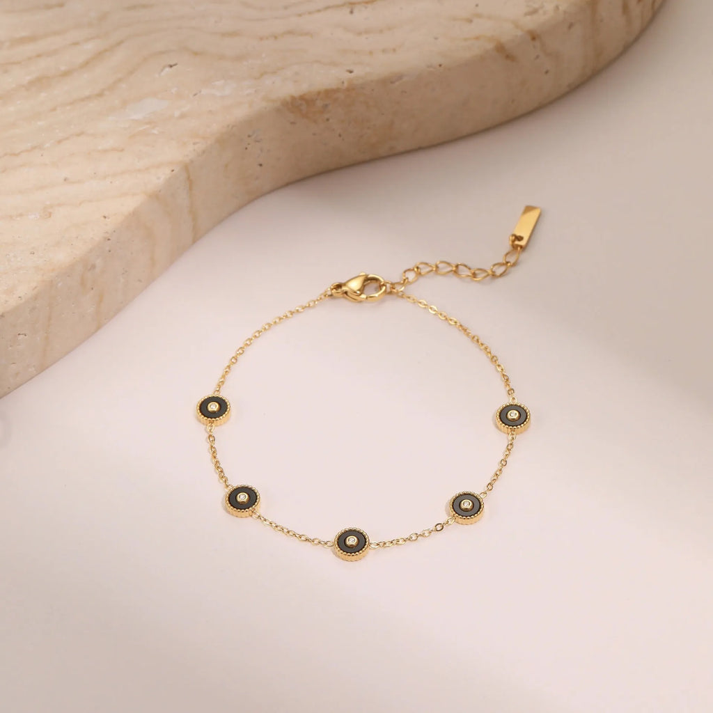 Women's stainless steel bracelet with 18K gold plating and geometric fritillary charm, includes matching necklace
