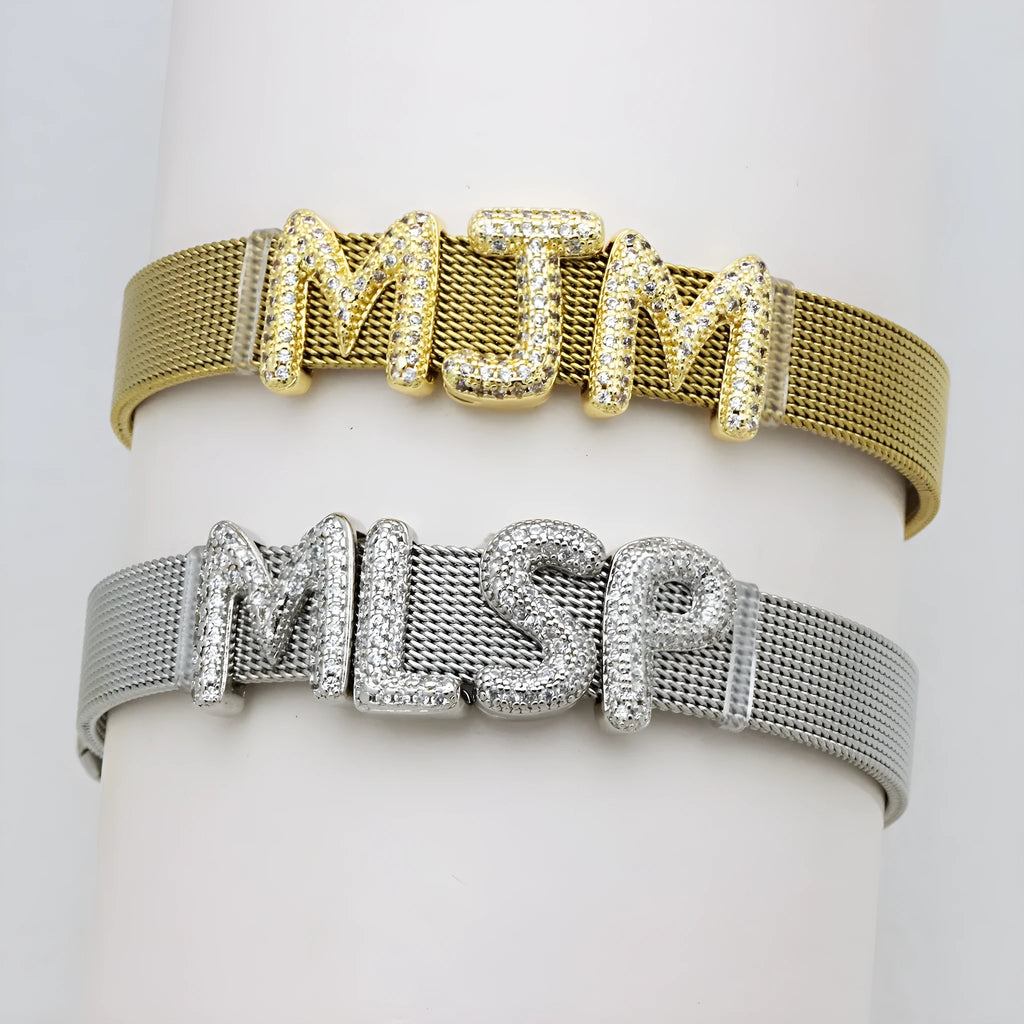 Copper letter bracelet with a single 'A' charm featuring micro inlaid zirconium detail on a gold-finished chain.