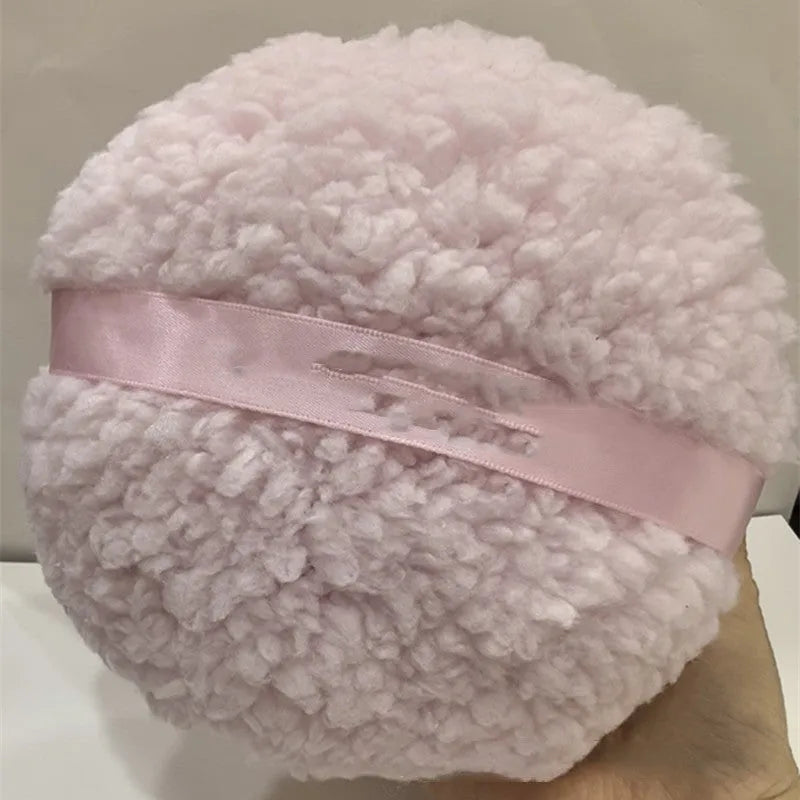 Oversized plush dry powder puff makeup applicator measuring 150x75mm in pink, white, and skin colour options