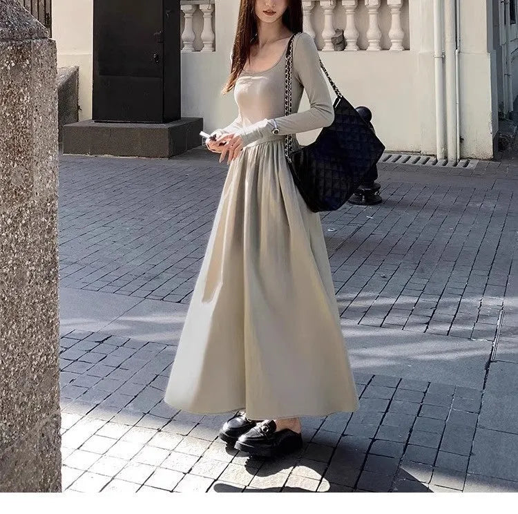 Black square collar knitted A-line dress with elastic waist and long sleeves on a model