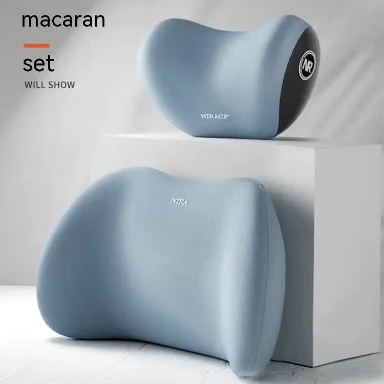 Black memory foam car lumbar support pillow and matching headrest pillow on a car seat.