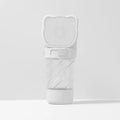 Green 3-in-1 portable pet water bottle with attached strap, water dispenser, food container, and garbage bag dispenser for dogs and cats