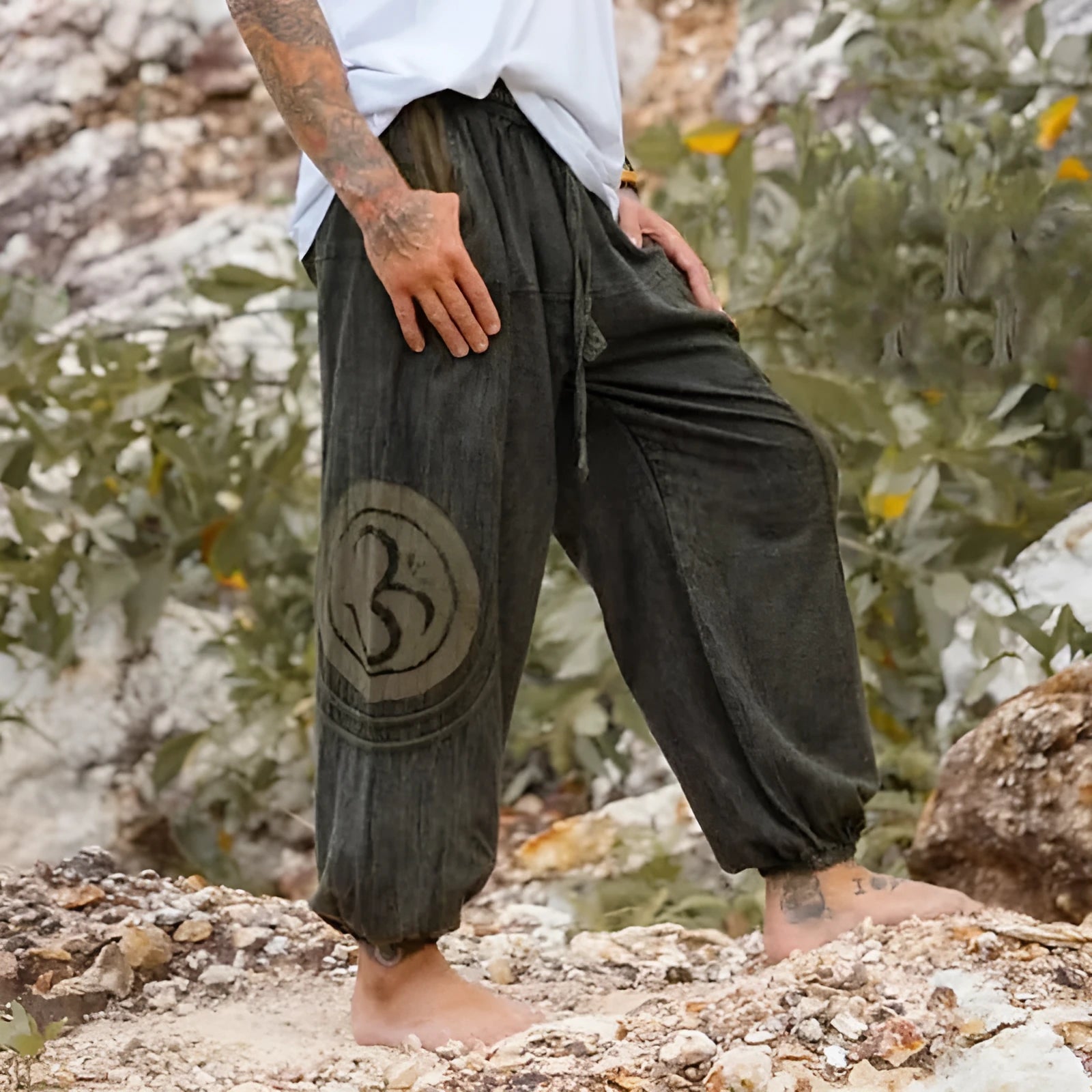 Men's dark green ethnic pattern trousers with elastic ankle ties, mid-waist design