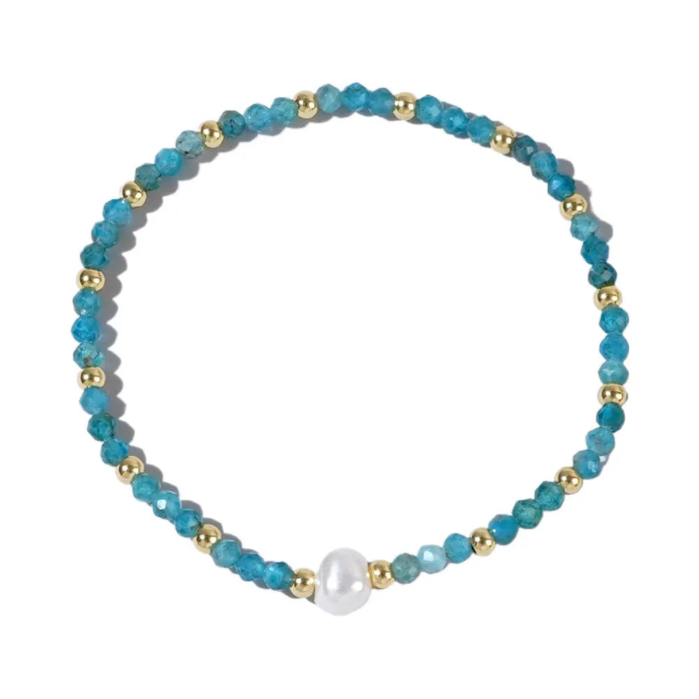 Close-up of a unisex natural stone bracelet with geometric ellipse beads on a wrist.