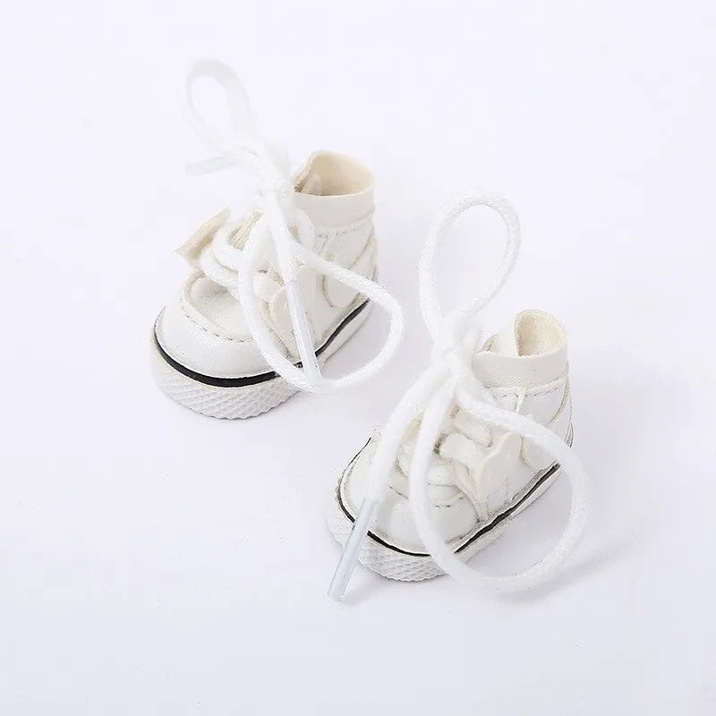 A pair of 17cm scale PU doll shoes in a selected colour and style, such as black leather shoes or brown boots.