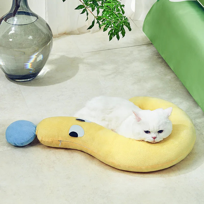 Blue rectangular pet sleeping pillow for cats and dogs on a floor, measuring 62cm by 39cm.