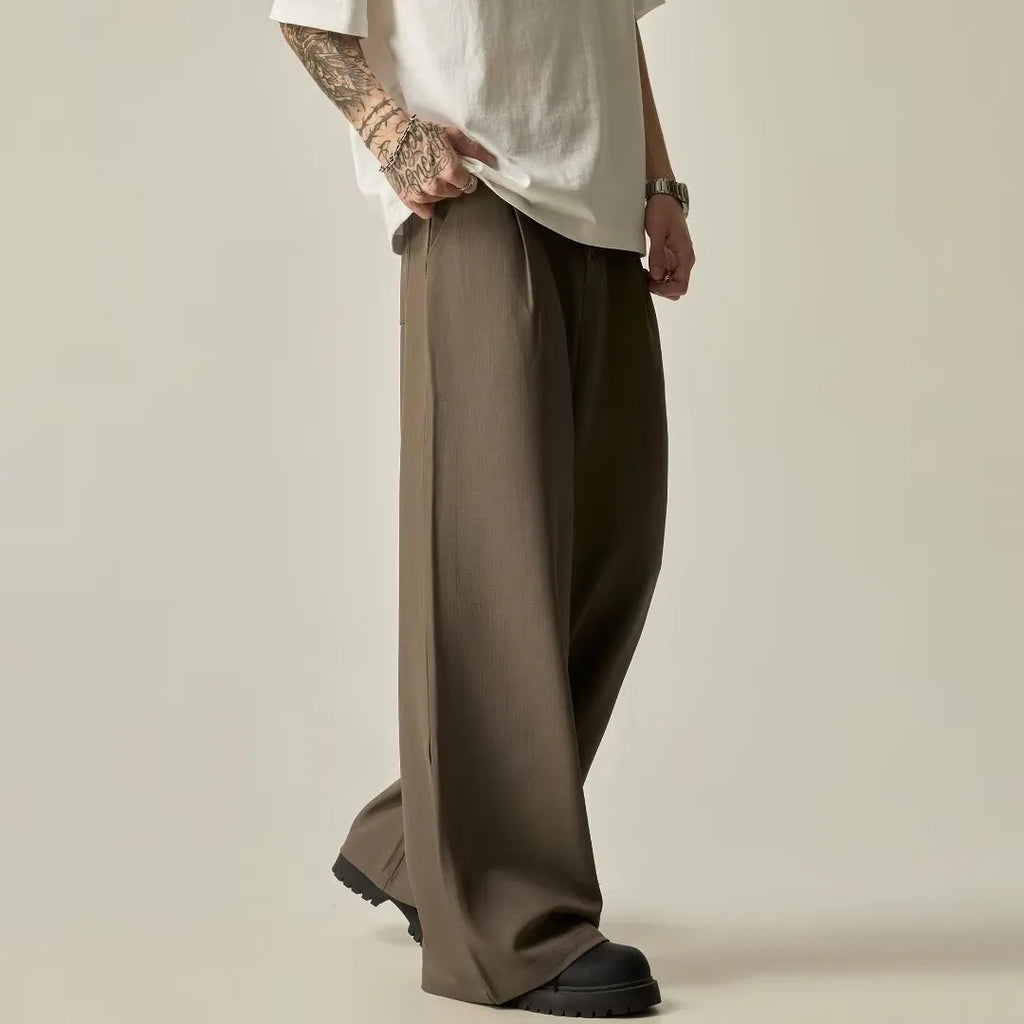 Men's solid colour straight-leg trousers in cotton-polyester blend fabric shown in black and brown colours