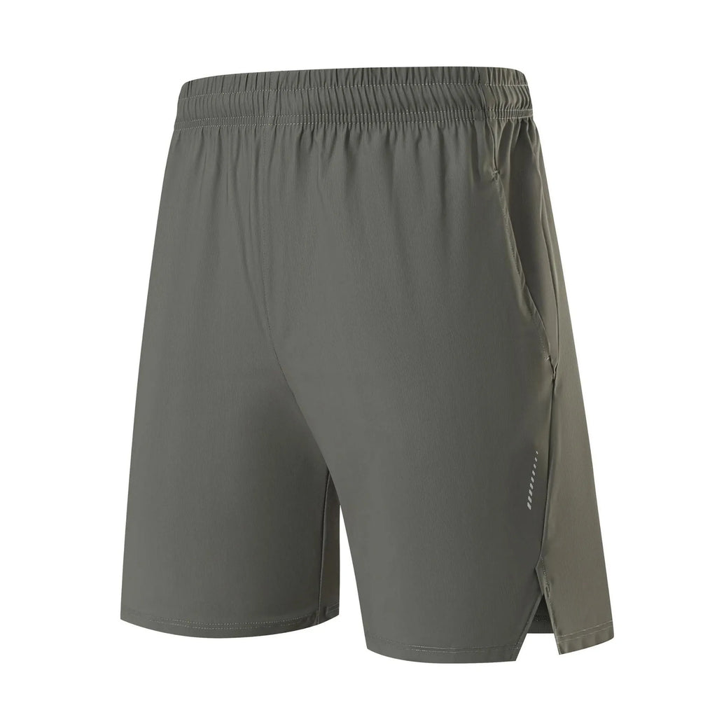 Man wearing grey ice silk nylon sports shorts with a mid-rise waistband.