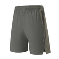 Man wearing grey ice silk nylon sports shorts with a mid-rise waistband.