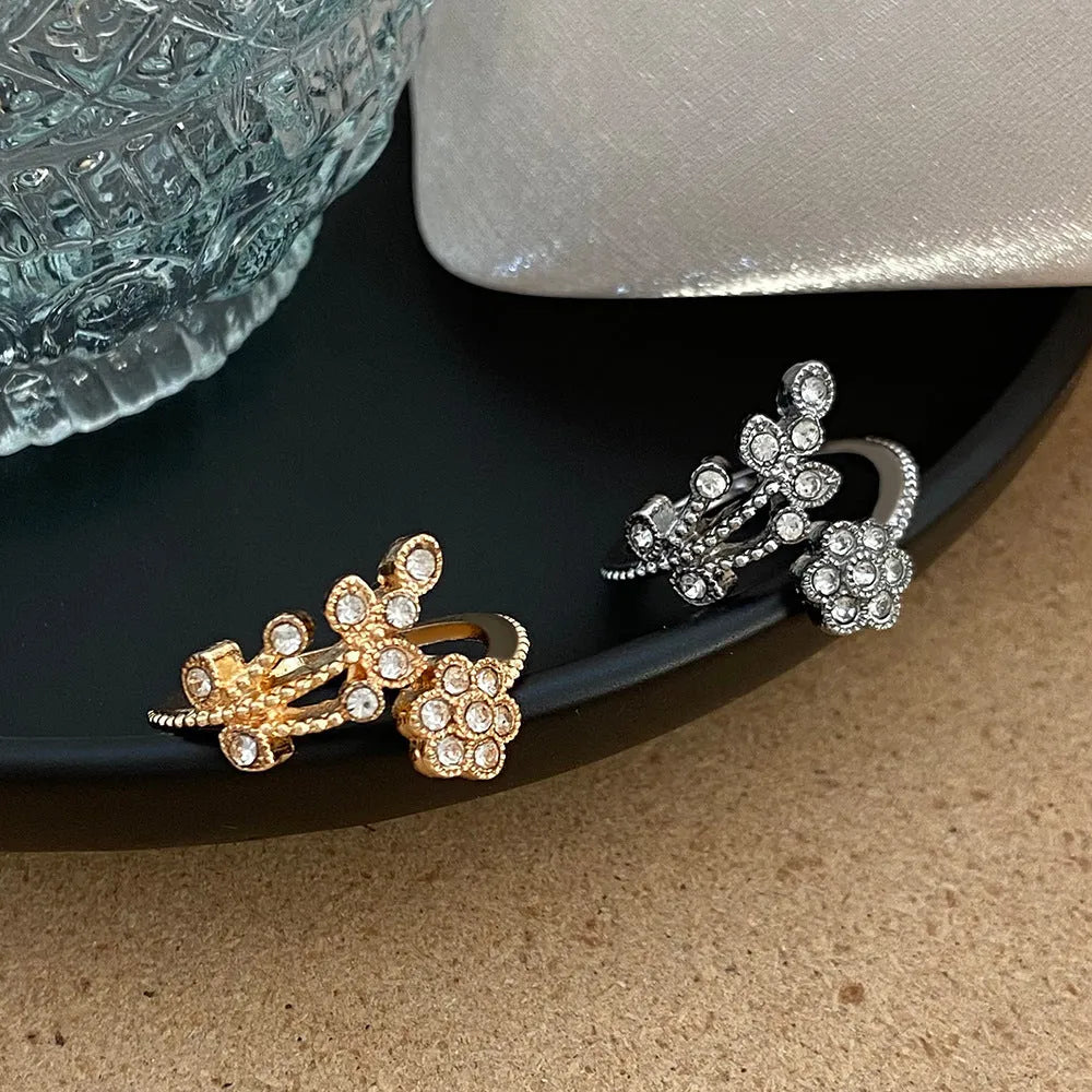 Gold diamond treated copper open ring with flower and leaf design for women