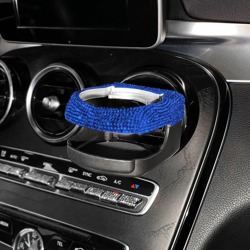 White diamond encrusted ABS plastic car cup holder mounted on a vehicle air vent.