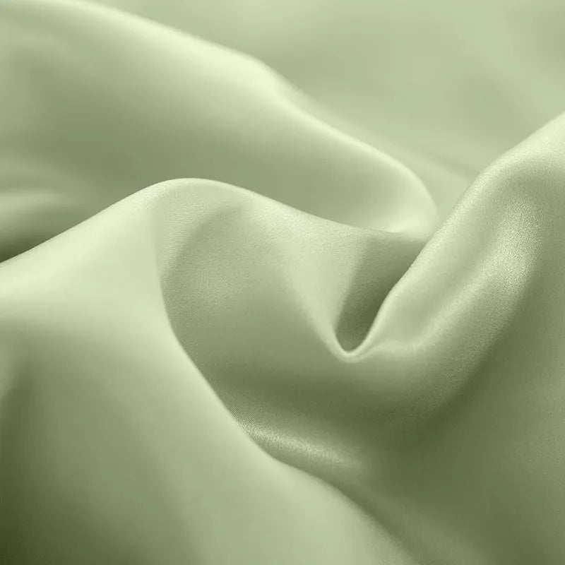 Solid colour silk duvet cover laid flat, showing plain weave texture in a choice of six colours.