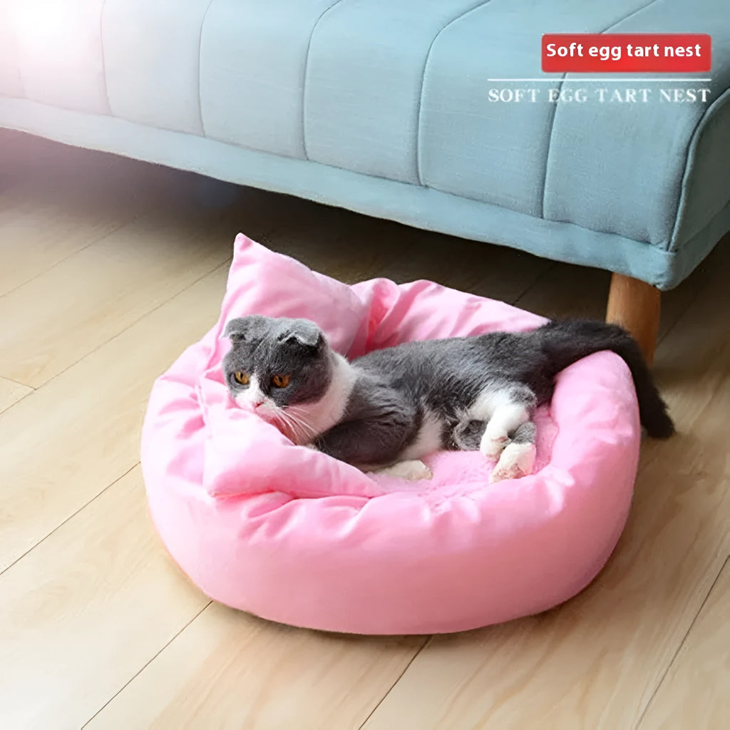 Light grey cotton-filled dog bed showing rounded shape and soft padding, with optional pillow beside it