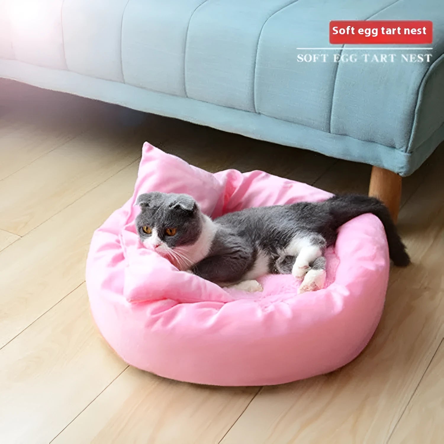 Light grey cotton-filled dog bed showing rounded shape and soft padding, with optional pillow beside it