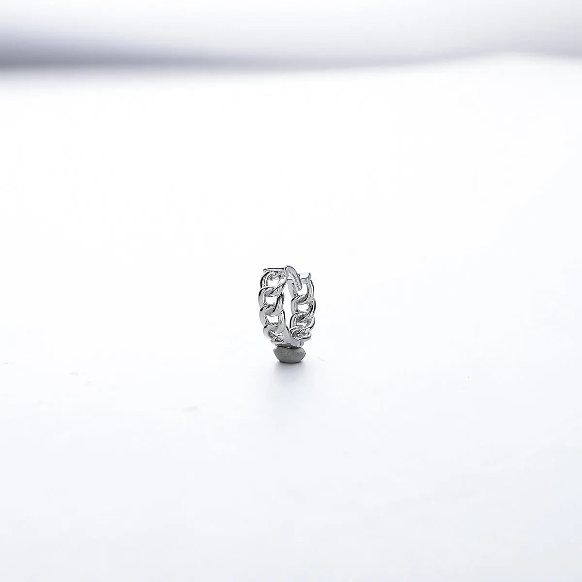 Men's polished copper geometric stud earrings in 10mm and 14mm sizes on a plain background.