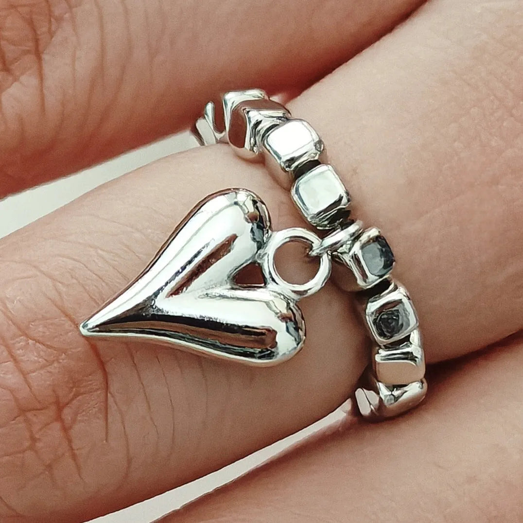 Handmade beaded elastic string love ring with geometric heart design in gold and white colour options