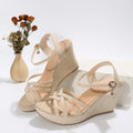 Women's simple wedge sandals with fish mouth toe in black and milky white on a neutral background.