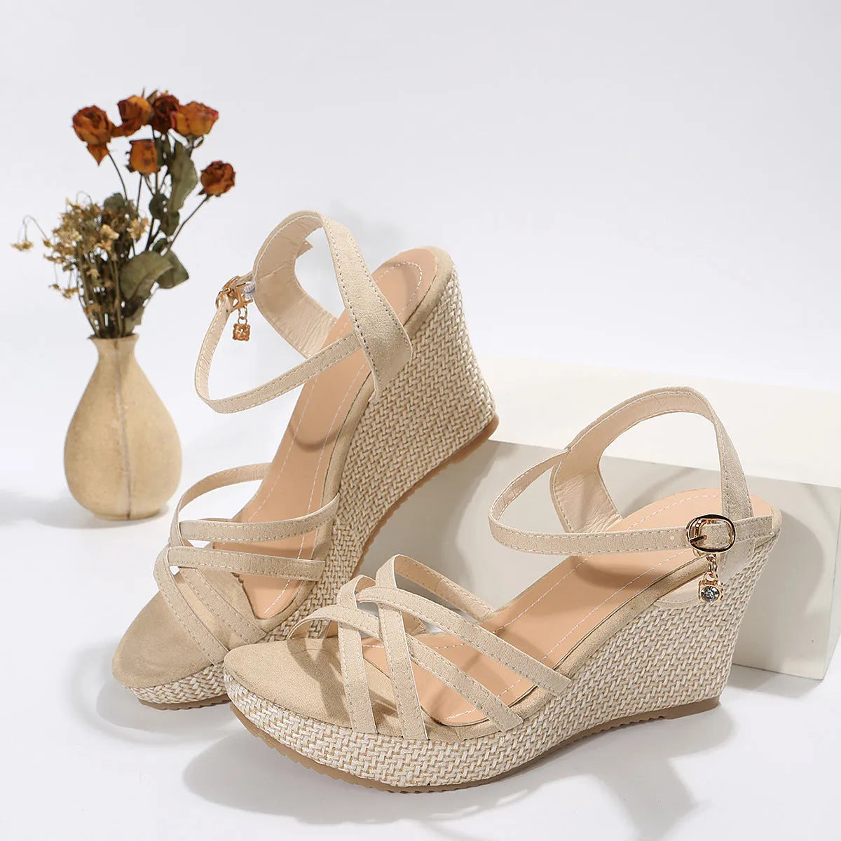 Women's simple wedge sandals with fish mouth toe in black and milky white on a neutral background.
