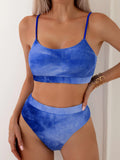 Women's orange and blue tie-dye pleated split bikini set on a mannequin