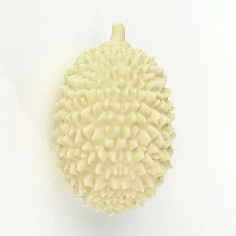 Durian-shaped dog chew toy in yellow with squeaker and tooth cleaning ridges
