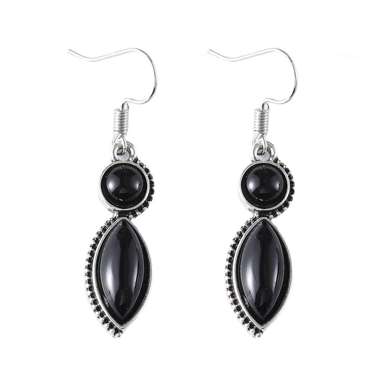 A pair of vintage geometric bohemian pendant earrings in black and purple with round design elements.