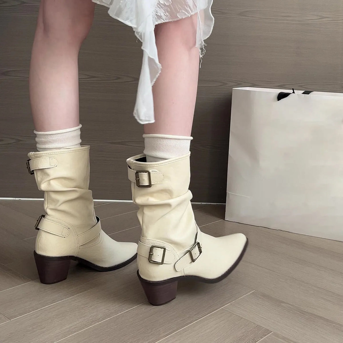 Women's mid-calf pointed toe chunky heel boots in white or khaki with PU upper and belt buckle detail