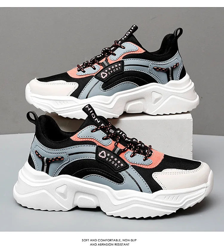 White women's thick-soled casual trainers with mesh upper and buckle detail