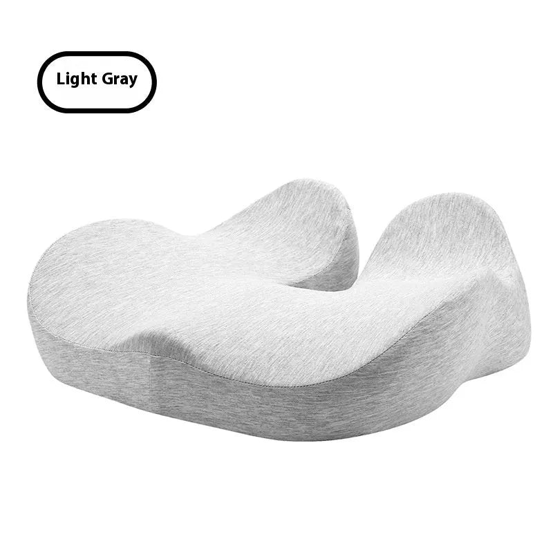Light grey memory foam office chair cushion with non-slip backing on a desk chair.