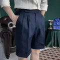 Men's linen blend double waist cuffed shorts in white, side view showing cuffed hem and relaxed fit