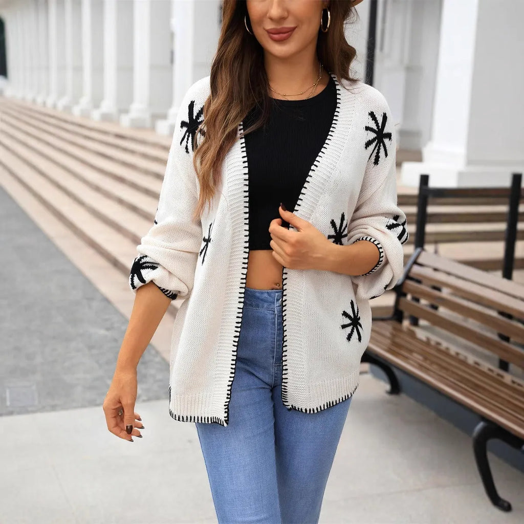 Beige plus size women's knitted cardigan coat with jacquard flower pattern, loose off-neck street fashion style.