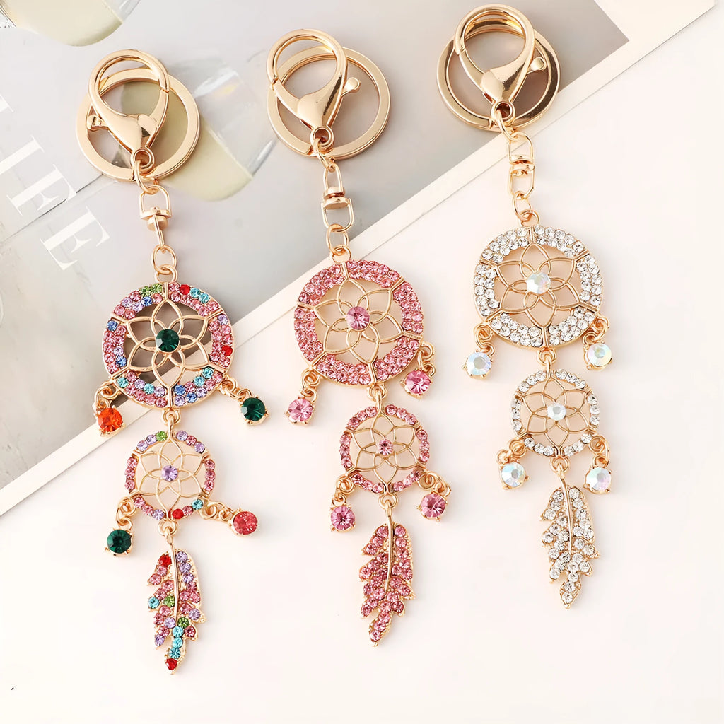 Creative diamond studded flower shaped car keychain dream catcher in pink alloy light luxury style on white background