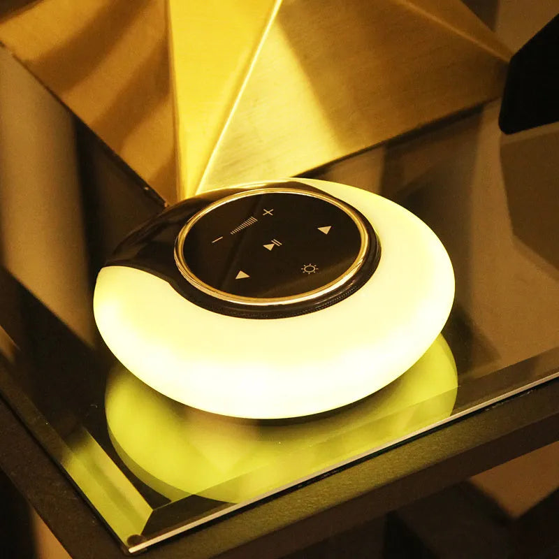 Blue Creative Bluetooth speaker desk lamp with foldable LED light and touch controls on a desk