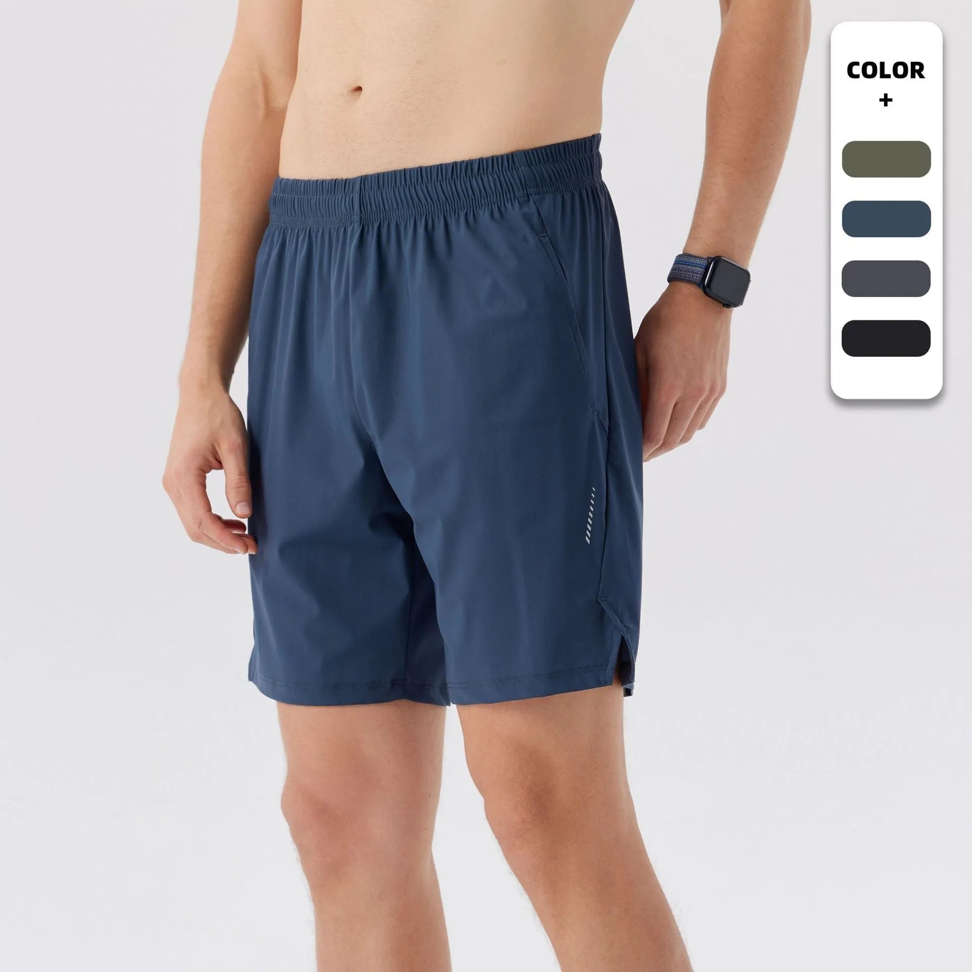 Man wearing grey ice silk nylon sports shorts with a mid-rise waistband.