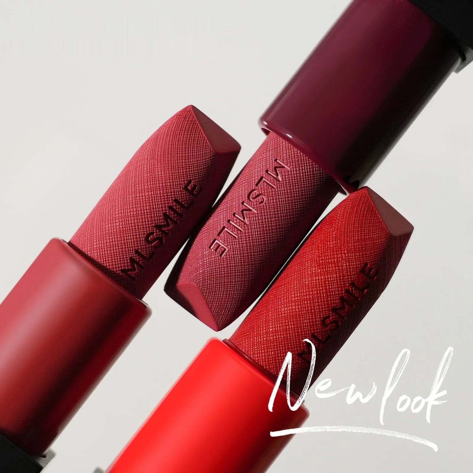 MLSMILE embossed lipstick three piece set showing three tubes in packaging box